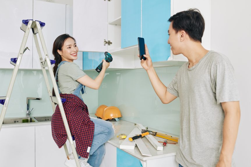 Couple filming DIY kitchen renovation video